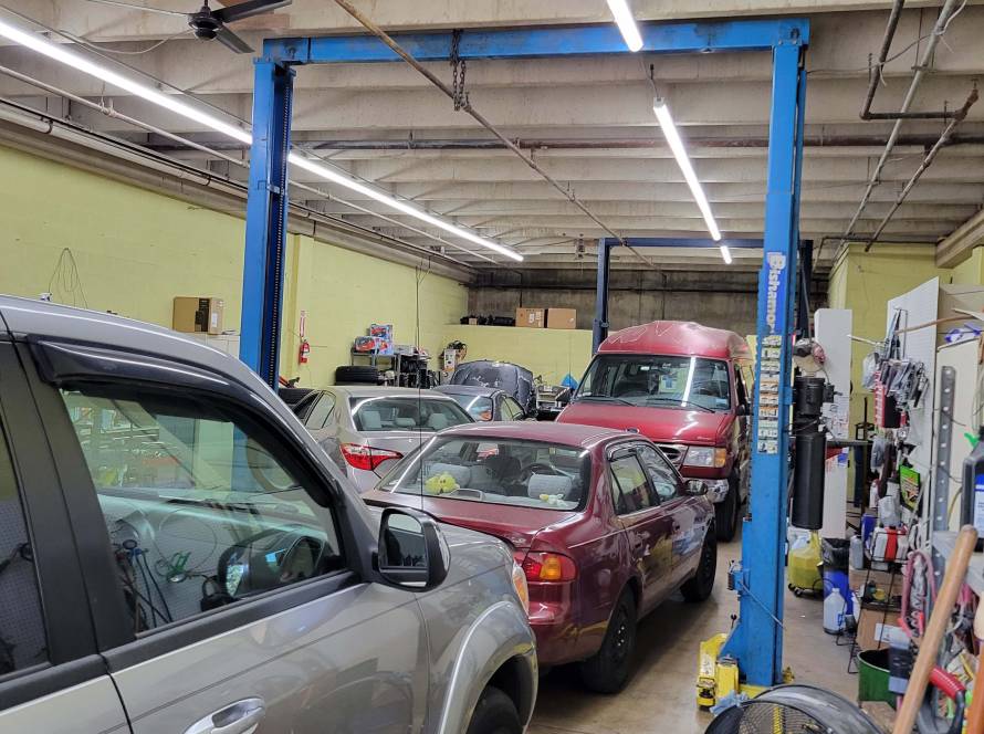 Vehicle safety inspection in progress at New Level Auto Service