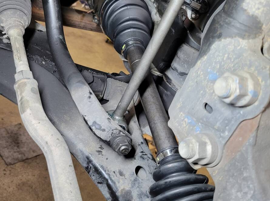 CV axle repair on a car lifted in the New Level Auto Service shop, Rockville MD