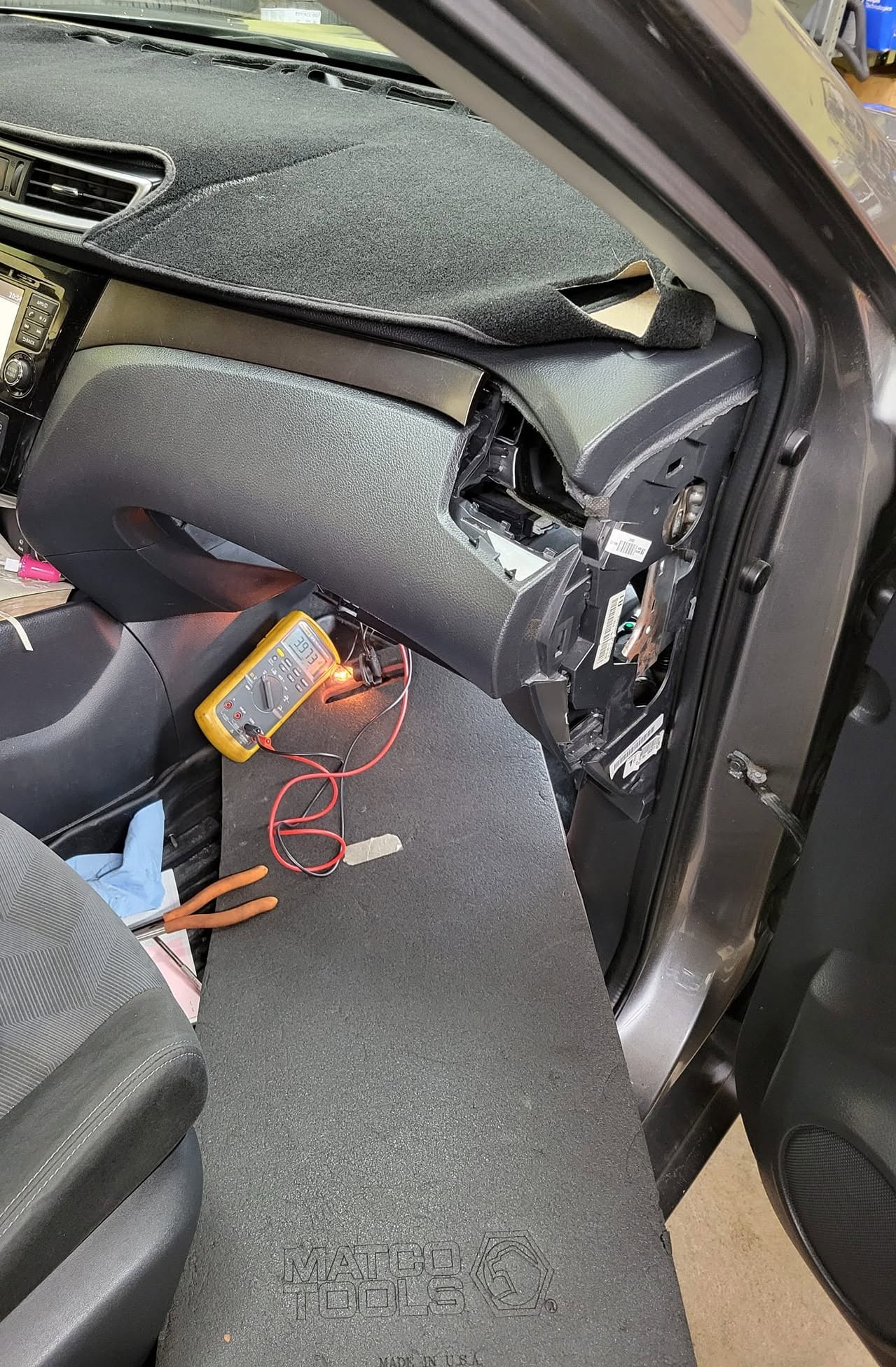 Blower motor removed from under the dashboard for A/C repair in Rockville, MD