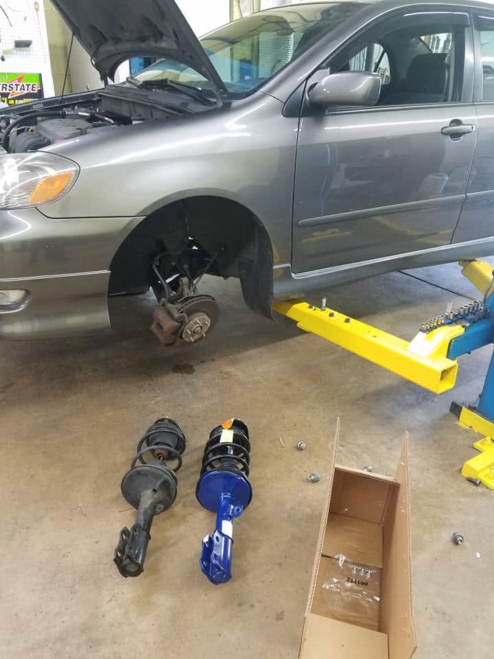 Complete strut assembly replacement for suspension repair at New Level Auto Service