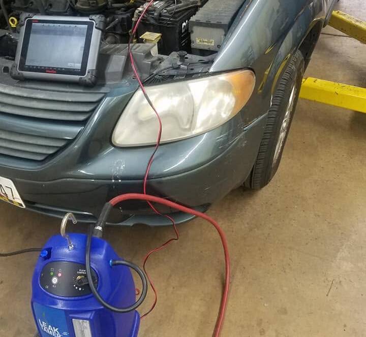 Smoke machine testing a car's EVAP system, a common check engine light cause, in Rockville, MD
