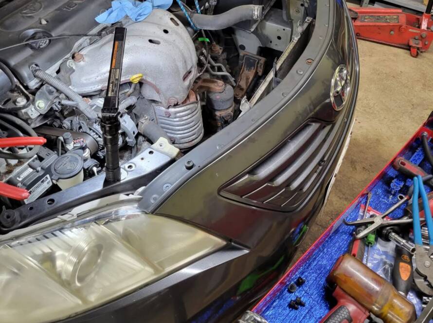 Radiator and cooling hoses, common causes of car overheating, on an engine at New Level Auto Service in Rockville, MD