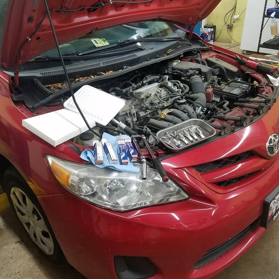 Car tune-up in progress at New Level Auto Service in Rockville, MD